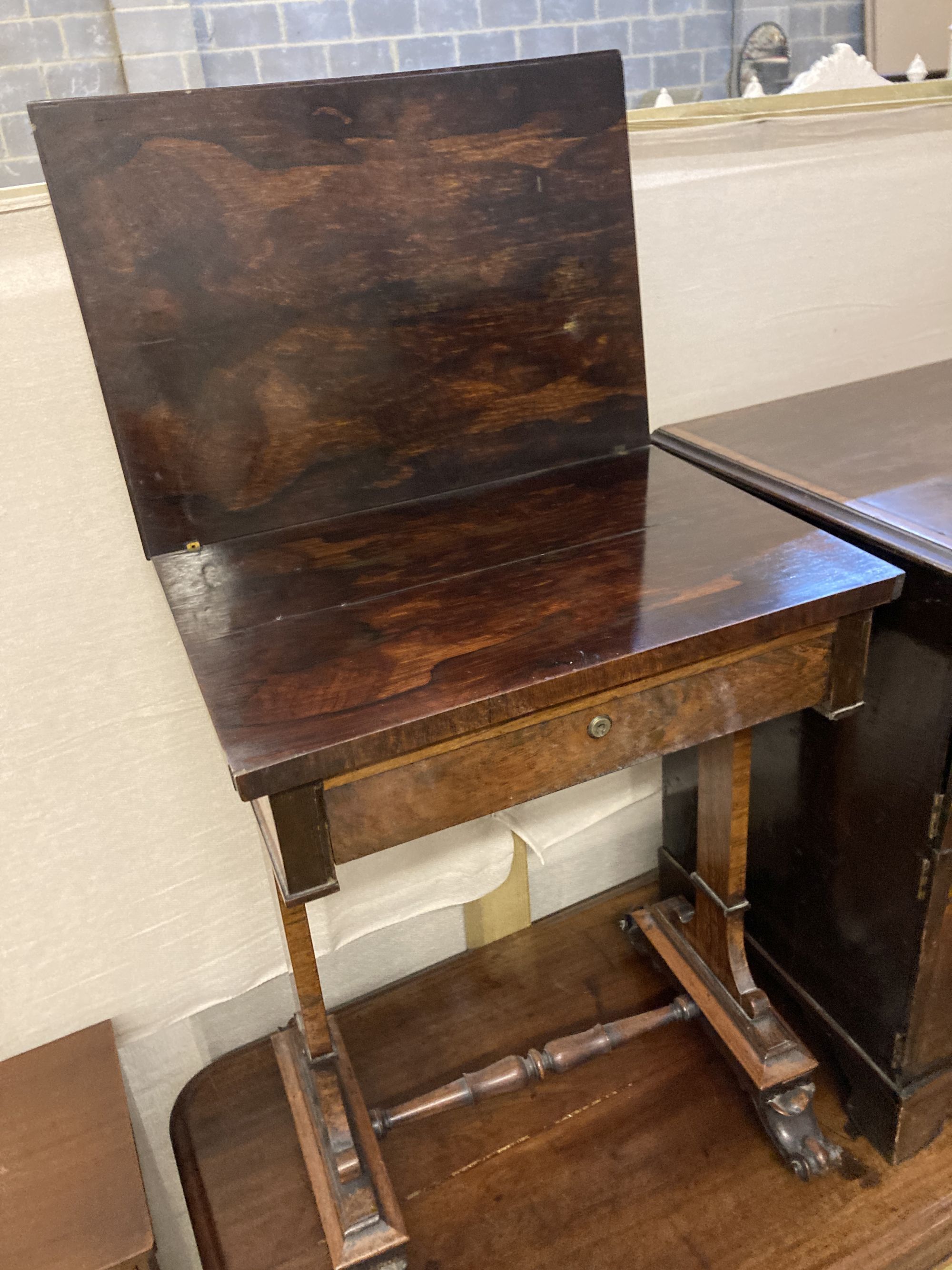 A Victorian rosewood work table, with a folding top, width 54cm depth 38cm height 71cm